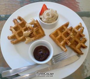 Waffles with berry coulis sauce (vegan) at Red Lime Shack in Port Adelaide