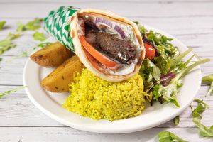 Kofta Pita Plate with Greek Lemon Roasted Potatoes, Greek Lemon Rice and House Mixed Greens Salad. at Veganarie - Resto Végan in Montreal