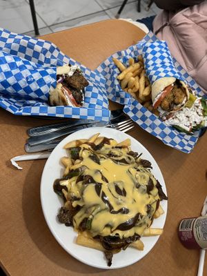 Animal fries, shittake gyro and soy chik'n gyro with fries and Greek salad   at Veganarie - Resto Végan in Montreal