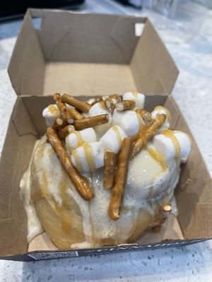 BYO roll with crème brûlée icing, caramel, pretzels, and marshmallows   at Cinnaholic in Carmel