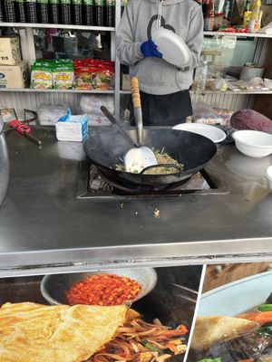 Watch the making of Pad Thai.  at Wat Huay Pla Kang in Chiang Rai