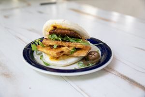 Breakfast Sandi- Boa Bun tofu egg spicy breakfast patty, avocado, chili oil 7 at Dear Mama in Los Angeles