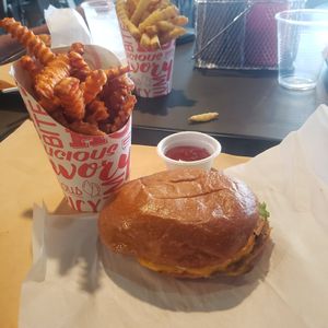 The burger looks small because I already ate some! at UNiQ Burger in Scottsdale