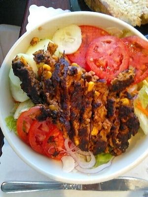 Black Bean Burger Salad: Apparently housemade
burger over a salad with lettuce, tomato, cucumber, purple cabbage, and onion. Choose a side of crackers, roll, or whole grain bread or toast. A good variety of housemate dressings;  green goddess & 1000 island were both excellent. at Christian and Jake's Bistro in Calhoun