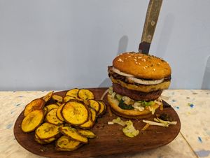 Hawaiian Burger with plantain chips at Vegano O No in Panama City