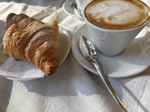 Vegan croissant and cappuccino with soy milk   at Café Olimpia in Milan