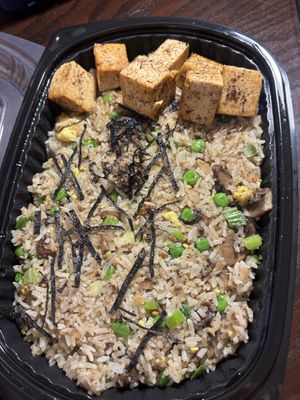 Mushroom fried rice with extra blackened tofu  at Planta Queen in Chicago