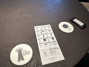 coasters with tarot imaging, beeper device  at Cafe Tarot - カフェタロ in Tokyo