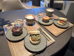 double chocolate muffin, mocha coffee, pepper sausage sandwich (with black pepper and sprouts), banana muffin, sausage sandwich (with ketchup and mustard)  at Cafe Tarot - カフェタロ in Tokyo