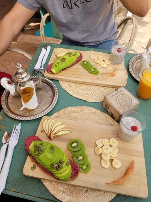 Breakfast with avocado toast  at Pikala Cafe in Marrakech
