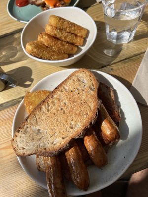 Vegan sausage sandwich and hashbrowns  at The Nectar House in Bristol