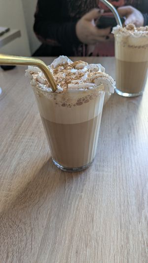 Pumpkin spice latte (vegan cream) at Fika Ladencafé in Munich