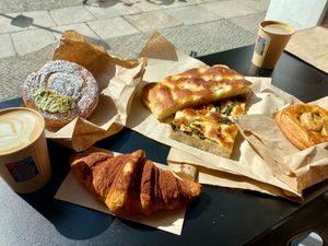 Focaccia, savory pastries, chocolate cornetto, and girella pistacchio at The Sanctuary in Berlin