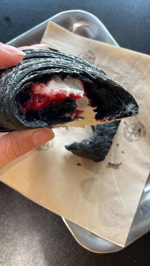 Black croissant with white chocolate and raspberry filling   at The Sanctuary in Berlin