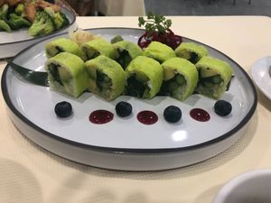 Raw veggies sushi with avocado asparagus cucumber blueberry beets ginger  at Bodhi Village in Flushing