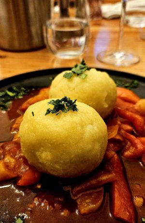 Potato dumplings stuffed with tempeh at Schlicht Vegan in Vienna