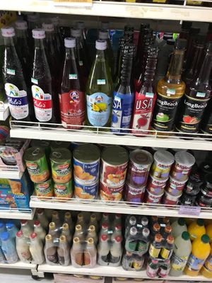 Canned and bottled vegan fruit-based treats at Bang Rak Minimart in Koh Samui
