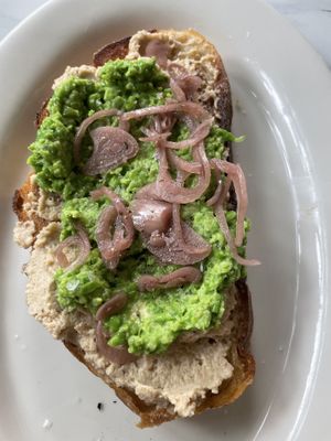 Spring tartine with mashed pea and cashew feta   at Finch & Pine in Seattle