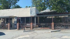 front of building at Sticks and Stones Clay Oven Pizza in Greensboro