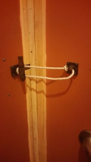 bathroom lock, love it! at Sticks and Stones Clay Oven Pizza in Greensboro