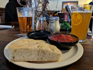 Homemade foccacia appetizer at Sticks and Stones Clay Oven Pizza in Greensboro