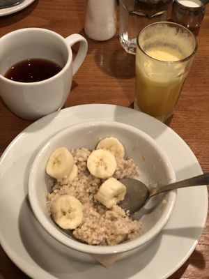 Steel Cut Oats with banana, rooibos tea and fresh squeezed orange/pineapple juice at The Good Earth in Roseville