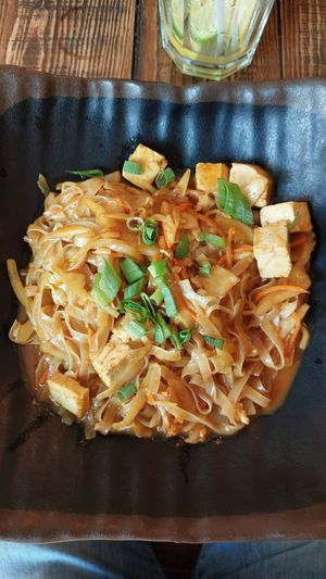 Rice noodles, tofu, yellow curry sauce at Buddha Original in Budapest