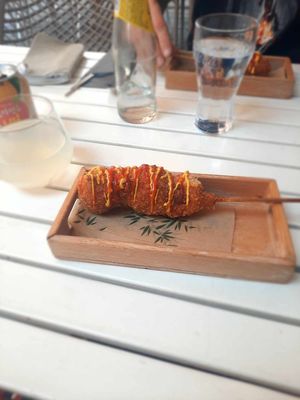 Vegan Korean corndog and pear juice (on the left) at Hey Joo - 헤이 주 in Ghent