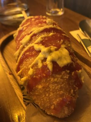 Vegan korean corndog with ketchup and mustard  at Hey Joo - 헤이 주 in Ghent