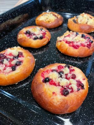 Vegan version of traditional Kolaches - Czech national pastry made of yeast dough, vanilla cream based on coconut milk and mixed berries/blueberries or poppy seed with plums. at Kolacherie Celetna in Prague