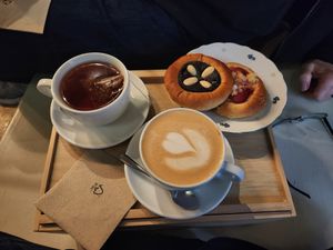 Poppyseed, and strawberry kolac with a cup of tea and a chai latte at Kolacherie Celetna in Prague