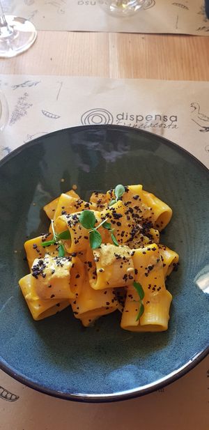 Mezzi paccheri con zucca, curry e crumble olive at Dispensa Franciacorta in Adro