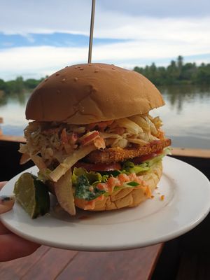 Tried the vegan smoked tofu burger with homemade slaw it was amazing! Packed full of veg and what a view. at The Hideaway in Kampot