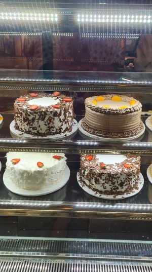 Cake Display Case- top two cakes are vegan at Fully Baked in Nairobi