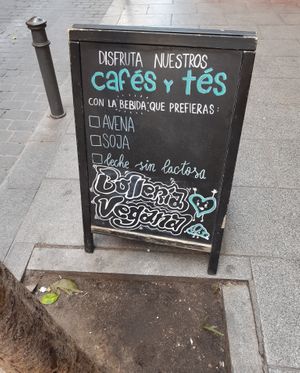 Sign on the street advertising vegan baked goods at La Barra Dulce in Madrid