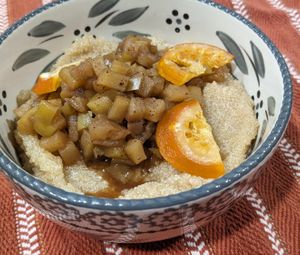 Amaranth porridge with fresh, warm apple compote and dried orange slices at Country Hearth Bed & Breakfast in New Holland