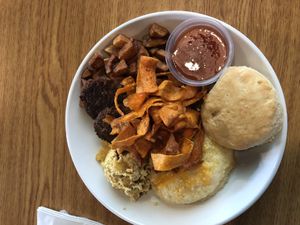 Brunch Bowl!!!!! Scrambled Tofu,Cheesy Grits,Fries,Carrot Bacon,sausage, at Bean Vegan Cuisine in Charlotte