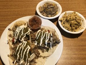 Jackfruit carnitas tacos with sides of tater tot casserole and Mac-n-cheez . at Bean Vegan Cuisine in Charlotte