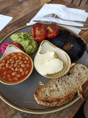 Vegan breakfast with so much butter for one slice of toast, such a waste of food. at The Market Place in Morpeth