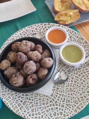 Papas arrugadas with mojo rojo and salsa verde at Jungle Vibes At The Marina (by Arabella) in Lanzarote