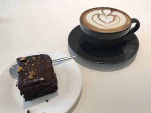 Cappuccino and brownie  at Six Spring Vegetarian Cafe in Penang