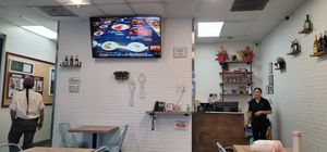 It's small and quaint, but it's a wonderful place. They also serve alcohol for those who are looking for that, as the picture shows. The lady is Angela! at Blue Table Thai Cuisine in Bakersfield