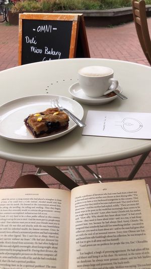 Blubbery cake and coffee with oat milk   at Omni - All Around Food in Groningen