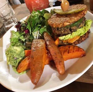 raw Vegan Burger and very tasty sweet potato wedges and avo salad at Wild Food Cafe in London