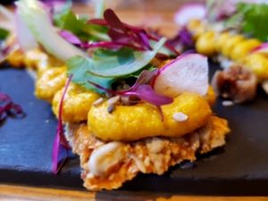 Spiced apricot hummus on raw cracker. So delicious! at Wild Food Cafe in London