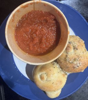 Garlic knots and marinara sauce   at Squatcho's in Rochester