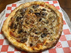 Mushroom and caramelized onion pizza with home cashew cheese   at Plant Based Trace in Gainesville