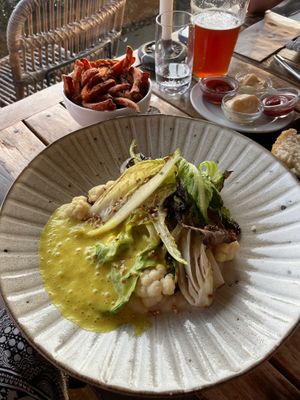 Grilled lettuce with coliflower puree and curry foam. at Surfers Lodge Restaurant in Ferrel