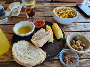 The bread, focaccia, olive plate. Was nice at Surfers Lodge Restaurant in Ferrel