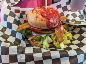 Brunch burger with LTO, just egg, umari bacon. Looks like a murder happened on it. Or someone got their period without planning for it. at The Dirty V in Apex